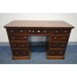 A VICTORIAN FLAME MAHOGANY KNEE HOLE DESK, with nine drawers, width 128cm x depth 56cm x height