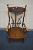 A LATE 19TH CENTURY ELM AND OAK SPINDLE BACK ARMCHAIR, with swept arm rests, on stretchered legs