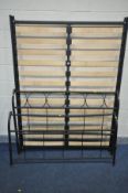 A METAL FRAMED 4FT6 BEDSTEAD