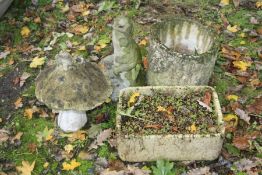 TWO COMPOSITE GARDEN ORNAMENTS, a mushroom with a fairy to top and a putto holding a fish water