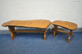 A RUSTIC OAK COFFEE TABLE, on a trestle base, and a similar occasional table (2)