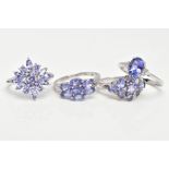 FOUR 9CT GOLD TANZANITE RINGS, oval cut tanzanite, six zircon accent stones, prong set on a slightly