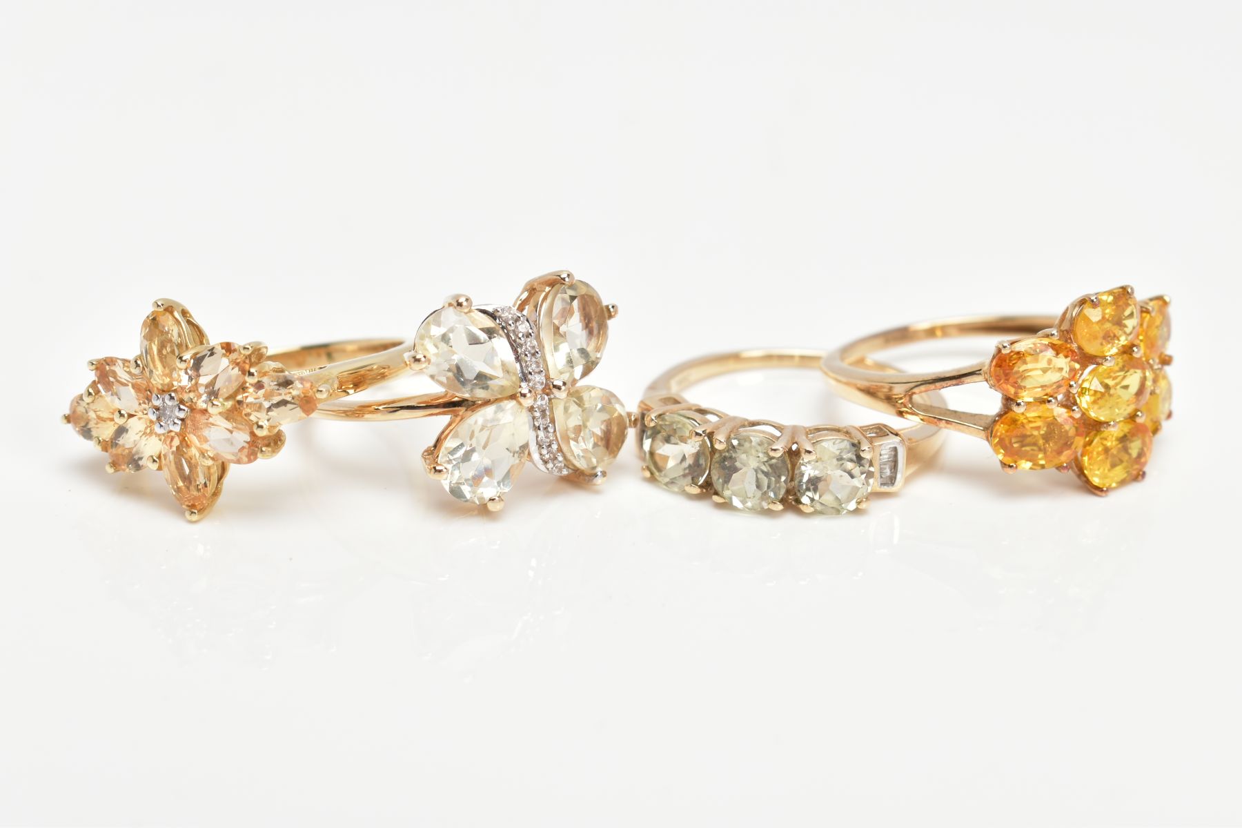 FOUR 9CT GOLD GEM SET DRESS RINGS, to include an orange sapphire seven stone ring, a marquise - Image 2 of 3