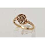 A 9CT GOLD BROWN DIAMOND CLUSTER RING, the cluster of a flower shape, set with nine round