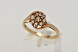 A 9CT GOLD BROWN DIAMOND CLUSTER RING, the cluster of a flower shape, set with nine round