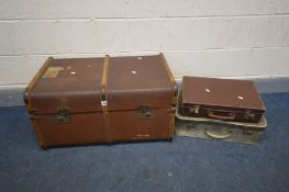 A VINTAGE CANVAS AND WOODEN BOUND TRAVELING TRUNK (missing internal tray and right handle) along