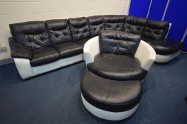 A BLACK AND WHITE LEATHER LOUNGE SUITE, comprising a rounded corner sofa, comes in four sections,