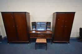 A STAG MINSTREL BEDROOM SUITE comprising a six drawer dressing chest with triple mirror, width 131cm