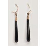 A PAIR OF TAPERED DROP EARRINGS, polished elongated drops, mounted with yellow metal fish