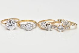 FIVE 9CT GOLD CUBIC ZIRCONIA SET DRESS RINGS, to include a large single stone ring, a three stone