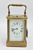 A 'HOWELL & JAMES' BRASS CARRIAGE CLOCK, white dial signed 'Howell & James' to the-Queen London,