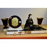 AN ART DECO ONYX, MARBLE, BRONZED SPELTER AND IVORY CLOCK GARNITURE, the clock with reclining female