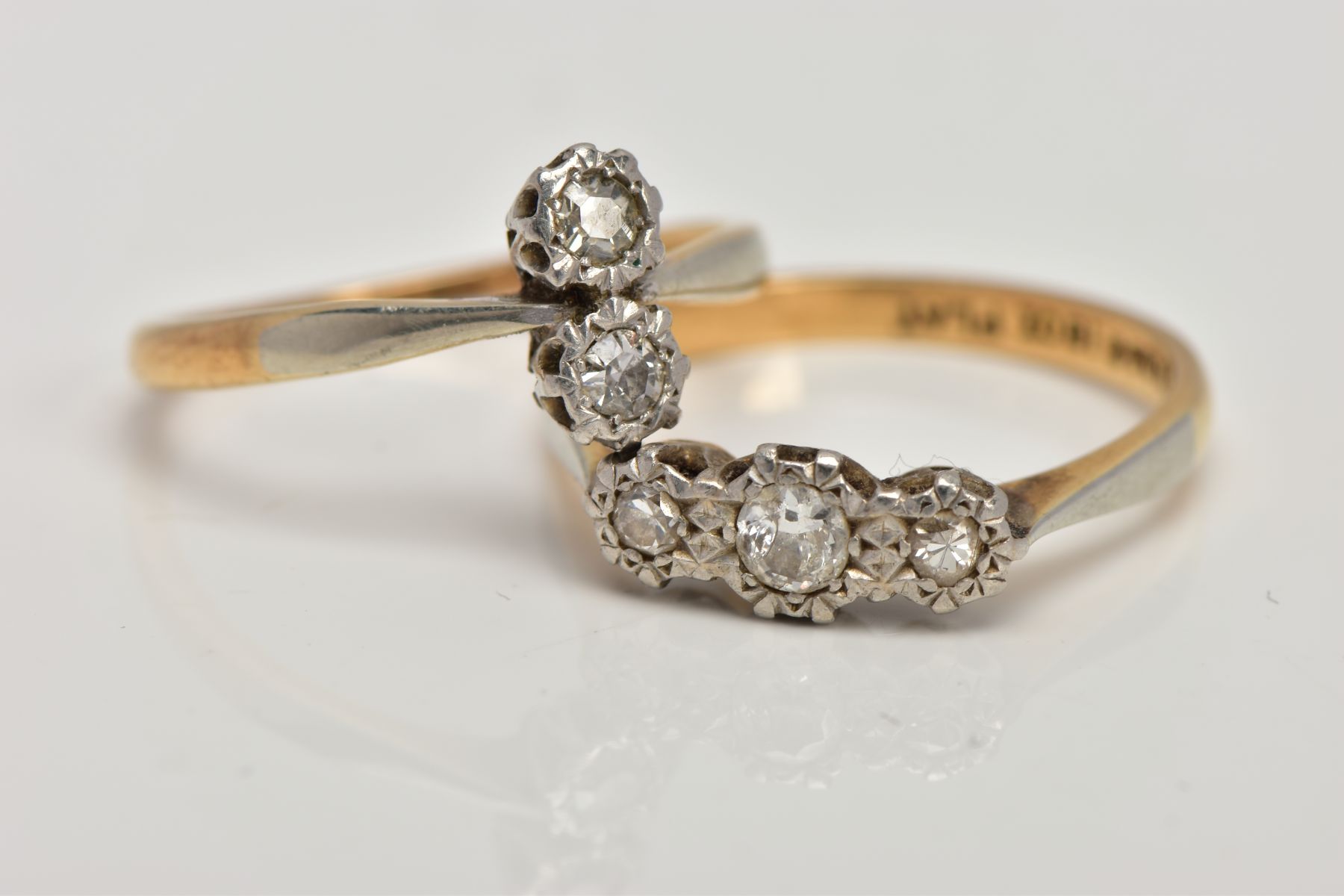 TWO DIAMOND RINGS, the first designed as three graduated brilliant cut diamonds, ring size M 1/2,