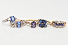 FIVE 9CT GOLD GEM SET RINGS, to include an eighteen stone topaz dress ring comprising two blue topaz