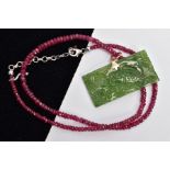 A RUBY AND GREEN HARDSTONE PENDANT NECKLACE, the pendant of a rectangular form carved with fish