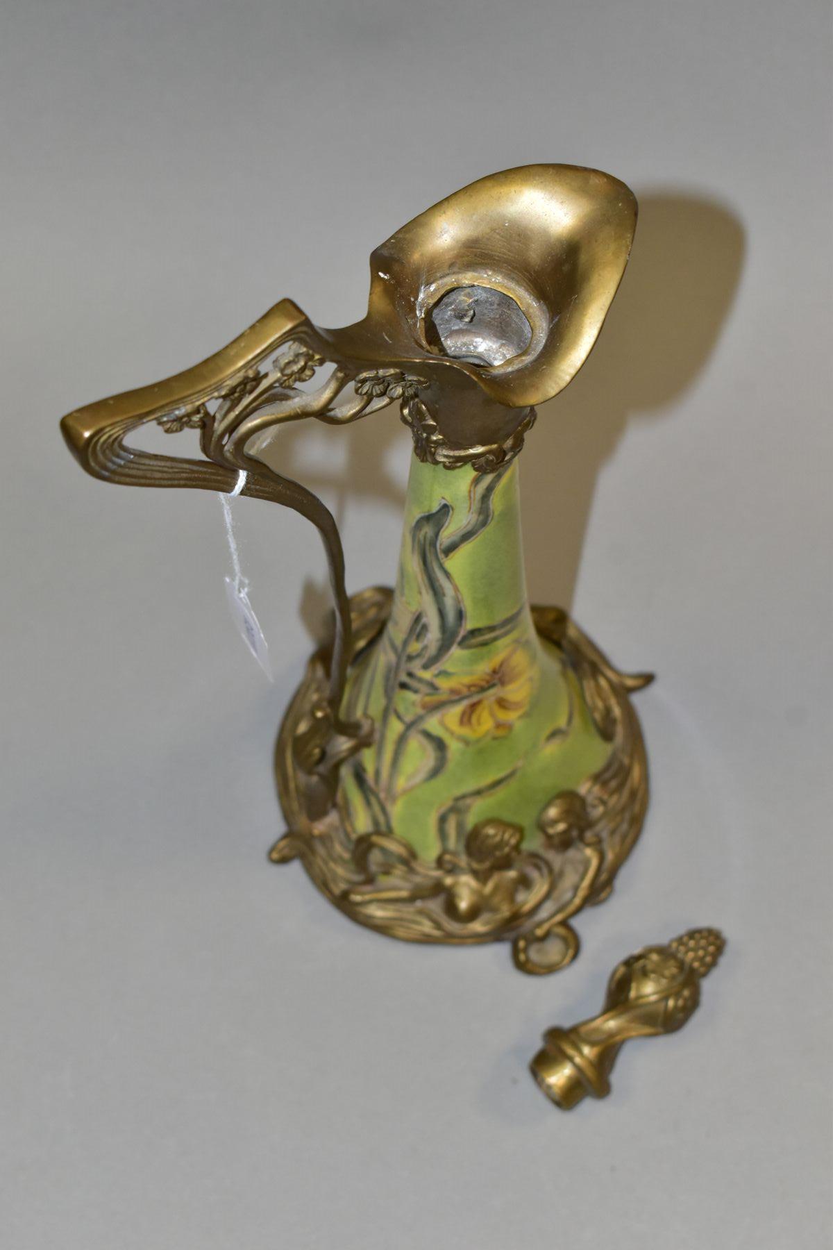 A REPRODUCTION ART NOUVEAU STYLE BRASS MOUNTED CERAMIC EWER, with foliate stopper, the wavy lip with - Image 4 of 7