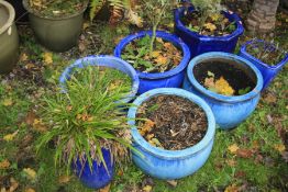 A COLLECTION SEVEN GLAZED PLANTERS comprising a pair of aqua blue, diameter 38cm x height 26cm, a