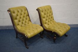 A PAIR OF MAHOGANY FRAMED BUTTONED GREEN LEATHER SLIPPER CHAIRS (condition:- one chair with loose