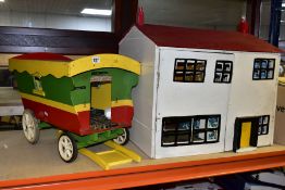 A WOODEN DOLLS HOUSE, modelled as a two storey detached house, front and rear opening to reveal