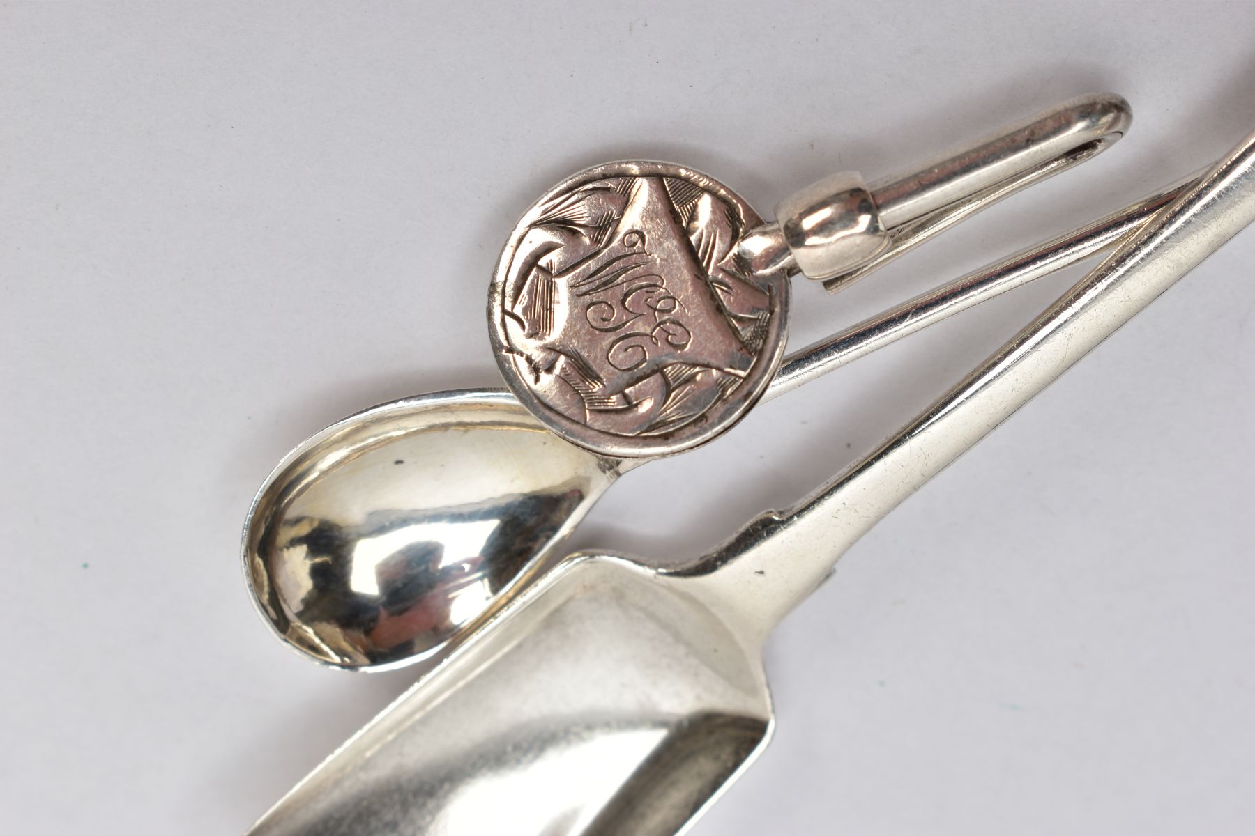 TWO SILVER SALT SPOONS AND A NAPKIN HOLDER, the first a fiddle pattern salt spoon in the form of a - Image 4 of 4