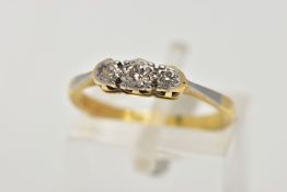 A YELLOW METAL THREE STONE DIAMOND RING, three graduated round brilliant cut diamonds (mounts are