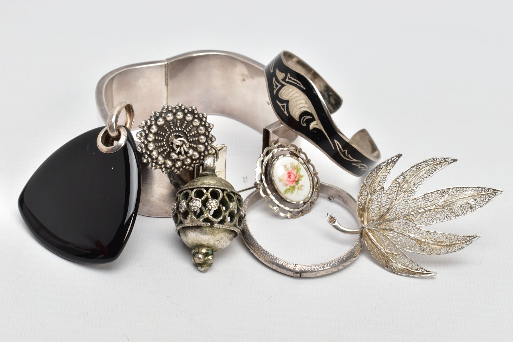 A BAG OF ASSORTED WHITE METAL JEWELLERY, to include a square shaped wide hollow bangle, fitted