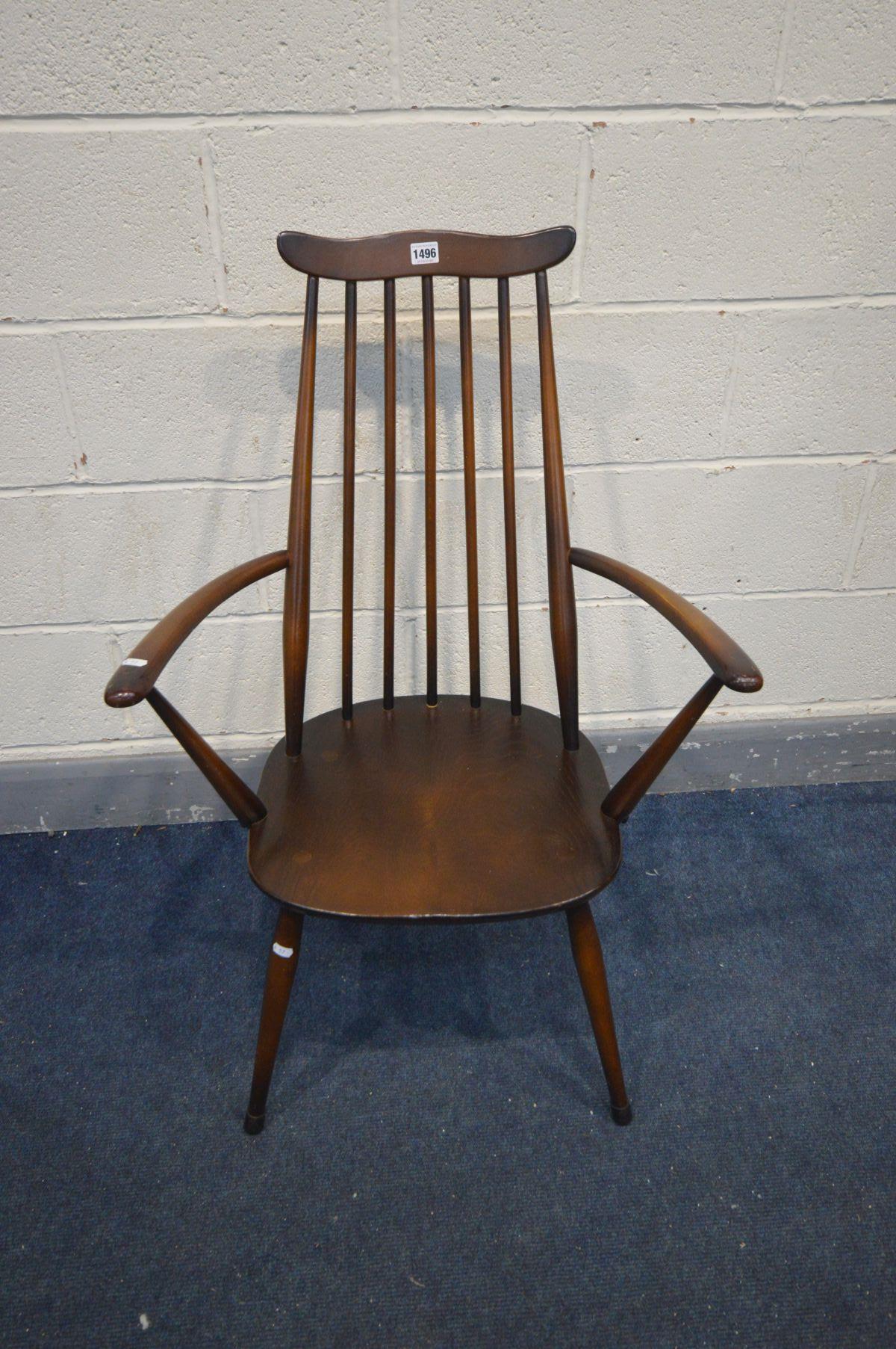 AN ERCOL DARK ELM AND BEECH GOLDSMITH ARMCHAIR - Image 2 of 2