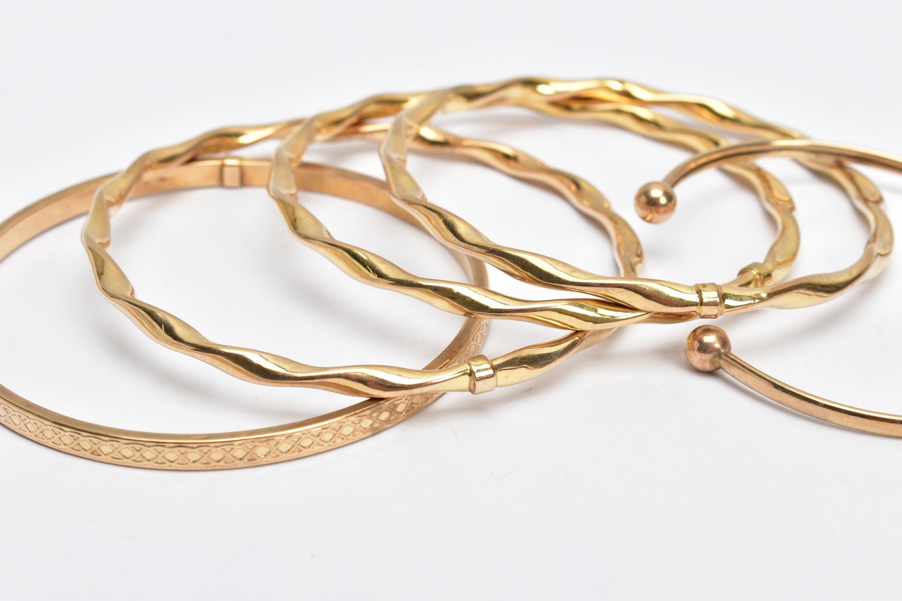 9CT GOLD BANGLES, to include three twisted hollow bangles, hallmarked 9ct gold Sheffield, one - Image 2 of 3