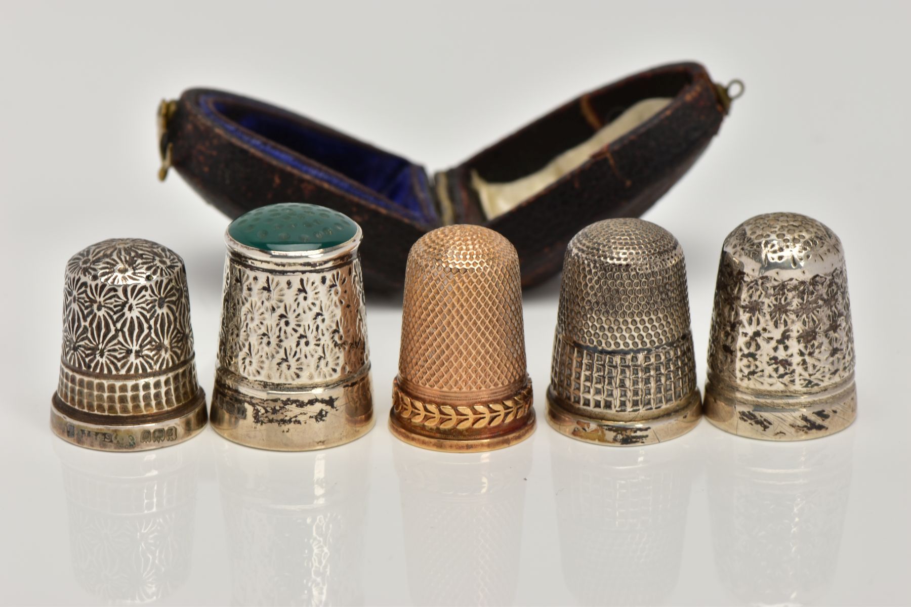 FIVE THIMBLES, to include an early 20th century gold thimble in a fitted case, approximate gross - Image 2 of 3