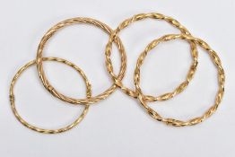 9CT GOLD AND YELLOW METAL BANGLES, to include one twisted hinged hollow bangle, hallmarked 9ct