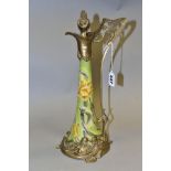 A REPRODUCTION ART NOUVEAU STYLE BRASS MOUNTED CERAMIC EWER, with foliate stopper, the wavy lip with