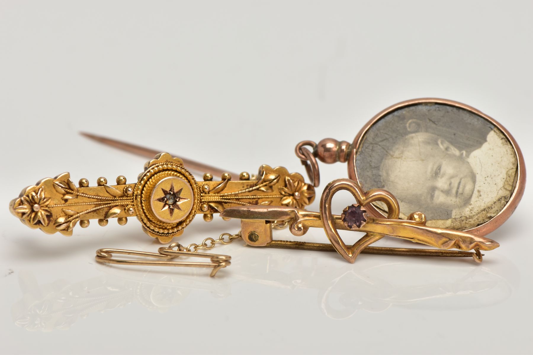 A VICTORIAN BROOCH, HEART BROOCH AND LOCKET, the Victorian brooch designed with a star set, rose cut - Image 3 of 3