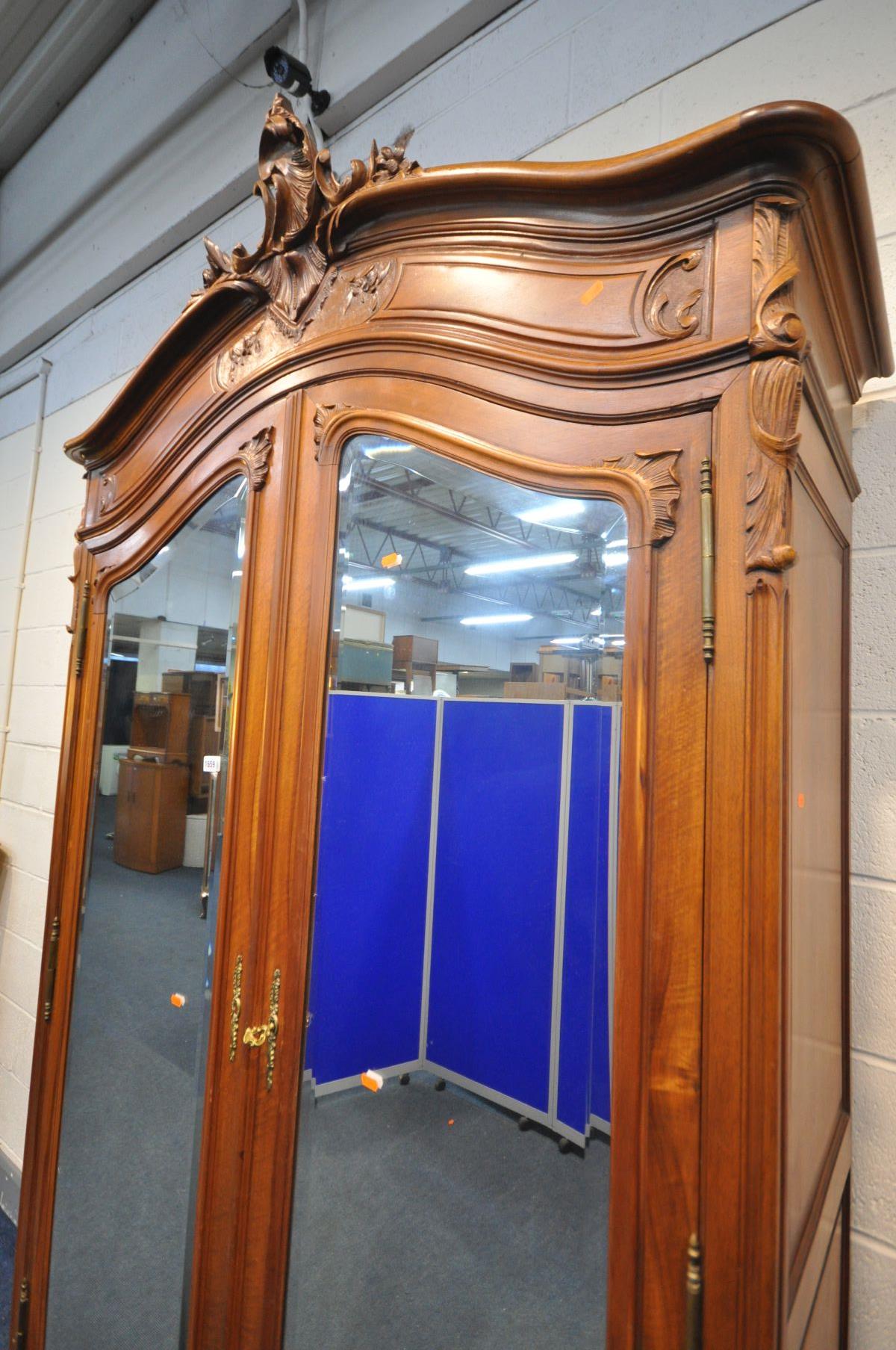 A FRENCH HARDWOOD ARMOIRE, with double bevelled edge mirror doors, enclosing three adjustable - Image 3 of 5