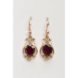 A PAIR OF 9CT GOLD GARNET DROP EARRINGS, each designed with a central oval cut garnet, within an