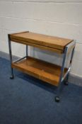 A MID CENTURY CHROME AND TEAK METEMORPHIC TEA TROLLEY (condition:-fluid stains)