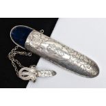 A LATE VICTORIAN SILVER SPECTACLES CASE, with engraved ivy leaf decoration, central scrolling