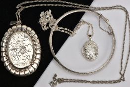 A LARGE SILVER LOCKET PENDANT NECKLACE, A WHITE METAL LOCKET NECKLACE AND A HINGED BANGLE, firstly a