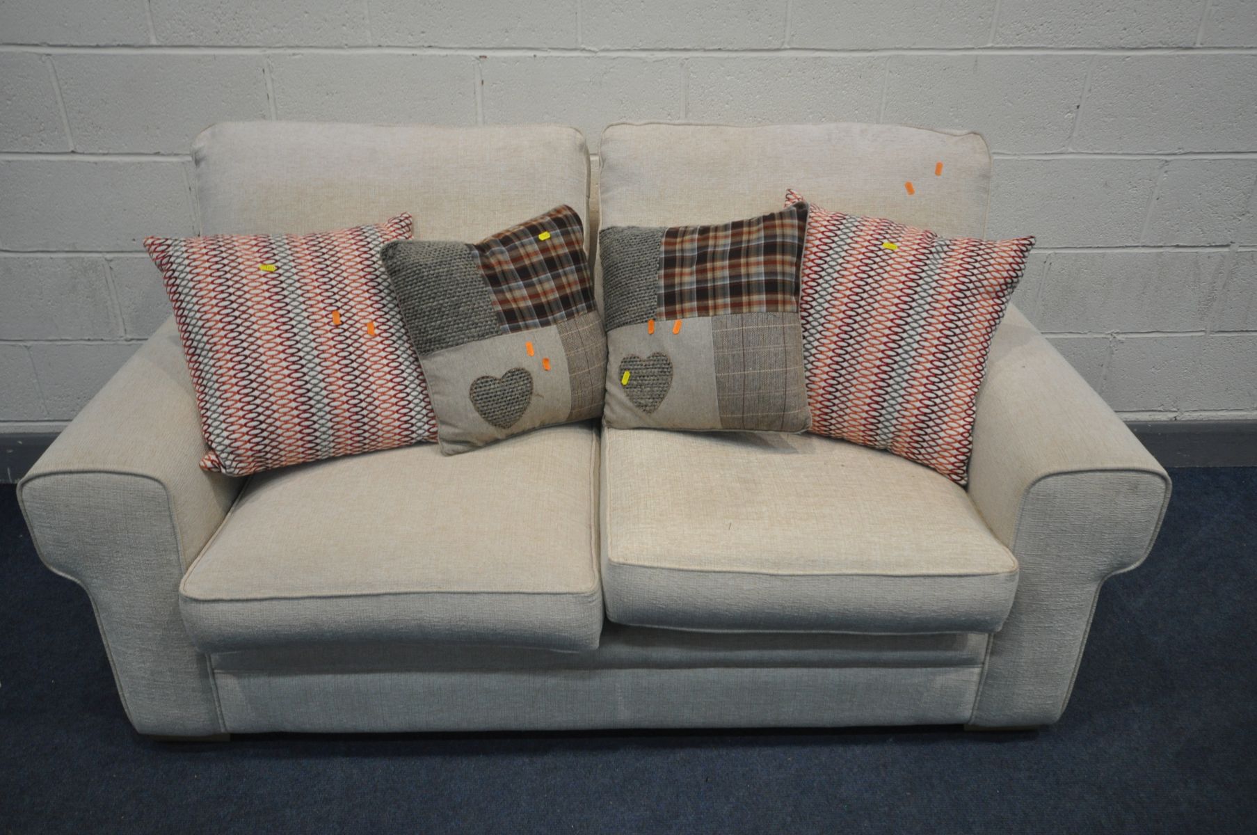 AN ALSTONS CREAM UPHOLSTERED TWO SEAT METAL ACTION SOFA BED, length 182cm