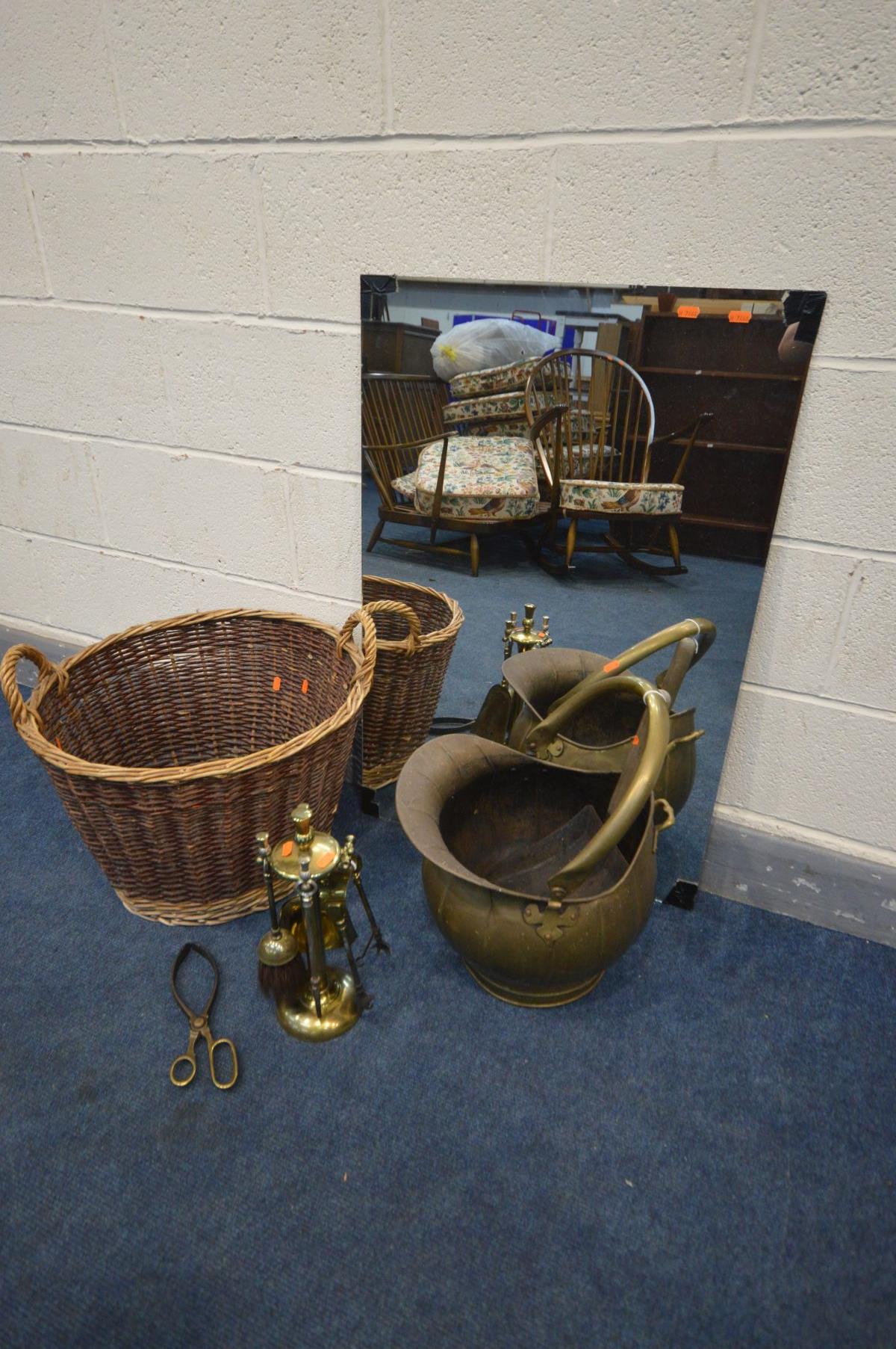 A WICKER LOG BASKET, along with a brass coal bucket, companion set, mirror, etc (5)