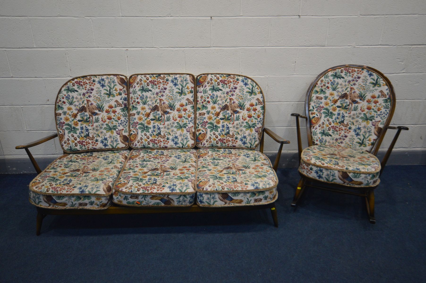 AN ERCOL WINSOR LOUNGE SUITE, with original cushions, comprising a three seater sofa, length