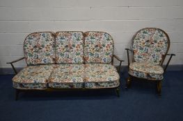 AN ERCOL WINSOR LOUNGE SUITE, with original cushions, comprising a three seater sofa, length