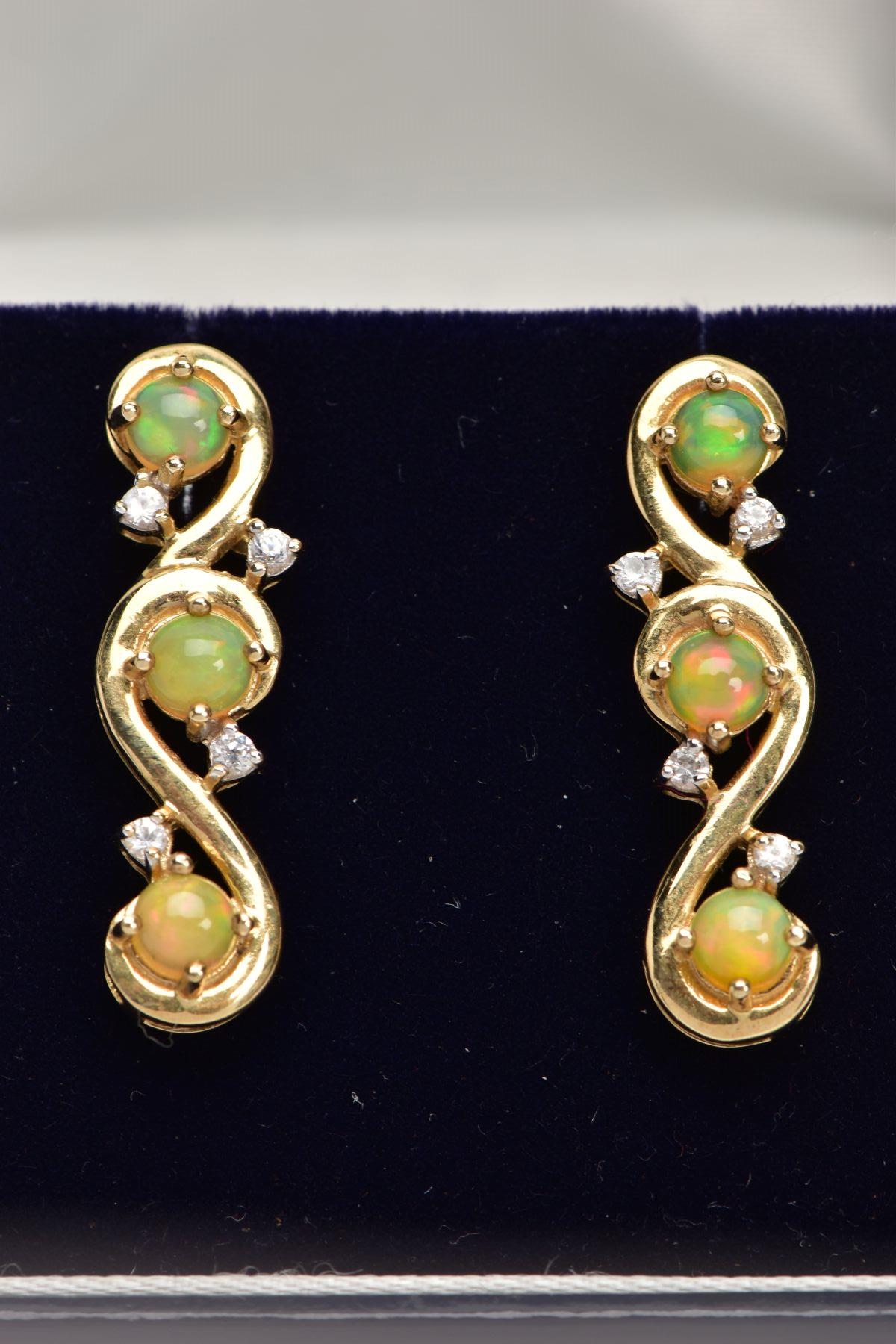 A PAIR OF 9CT GOLD, OPAL DROP EARRINGS, each drop set with three circular opal cabochons, and four - Image 2 of 2