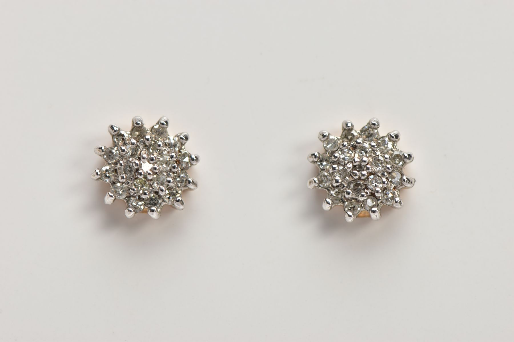 A PAIR OF 9CT GOLD DIAMOND CLUSTER EARRINGS, slightly raised cluster set with round brilliant cut - Image 2 of 2