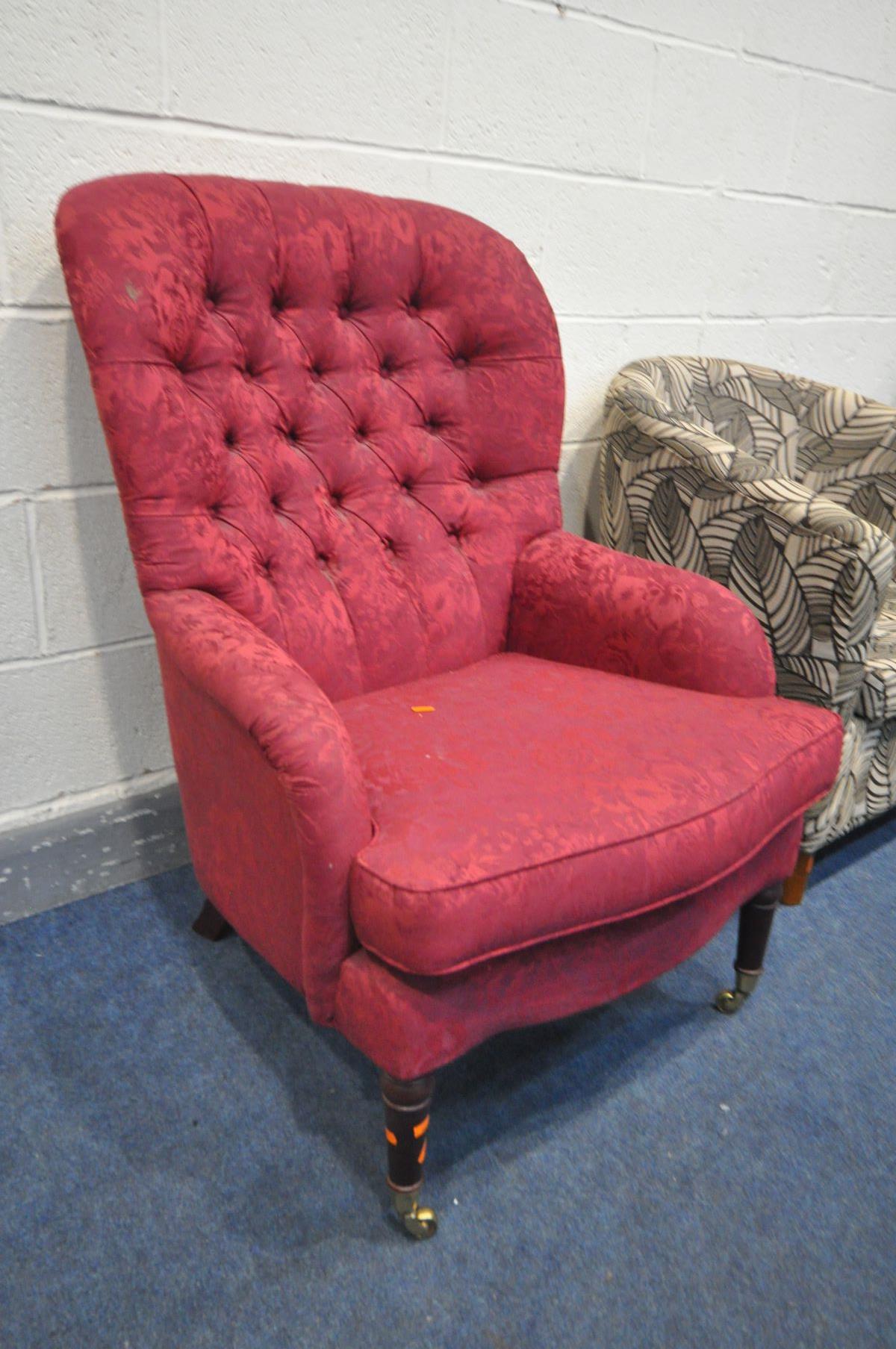 A PARKER KNOLL BUTTONED RED UPHOLSERED ARMCHAIR, on brass caps and casters, along with a floral - Image 2 of 3