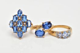 A 9CT GOLD KYANITE RING AND TWO 9CT GOLD TOPAZ RINGS, two stone ring, kyanite oval cut stones, cross