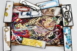A SELECTION OF COSTUME JEWELLERY to include a selection of beaded necklaces and bracelets etc
