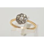 A YELLOW METAL DIAMOND CLUSTER RING, the cluster of a flower shape, set with eight old cut diamonds,