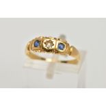 A YELLOW METAL SAPPHIRE AND DIAMOND RING, designed with a central old cut diamond, flanked with