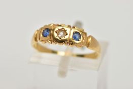 A YELLOW METAL SAPPHIRE AND DIAMOND RING, designed with a central old cut diamond, flanked with