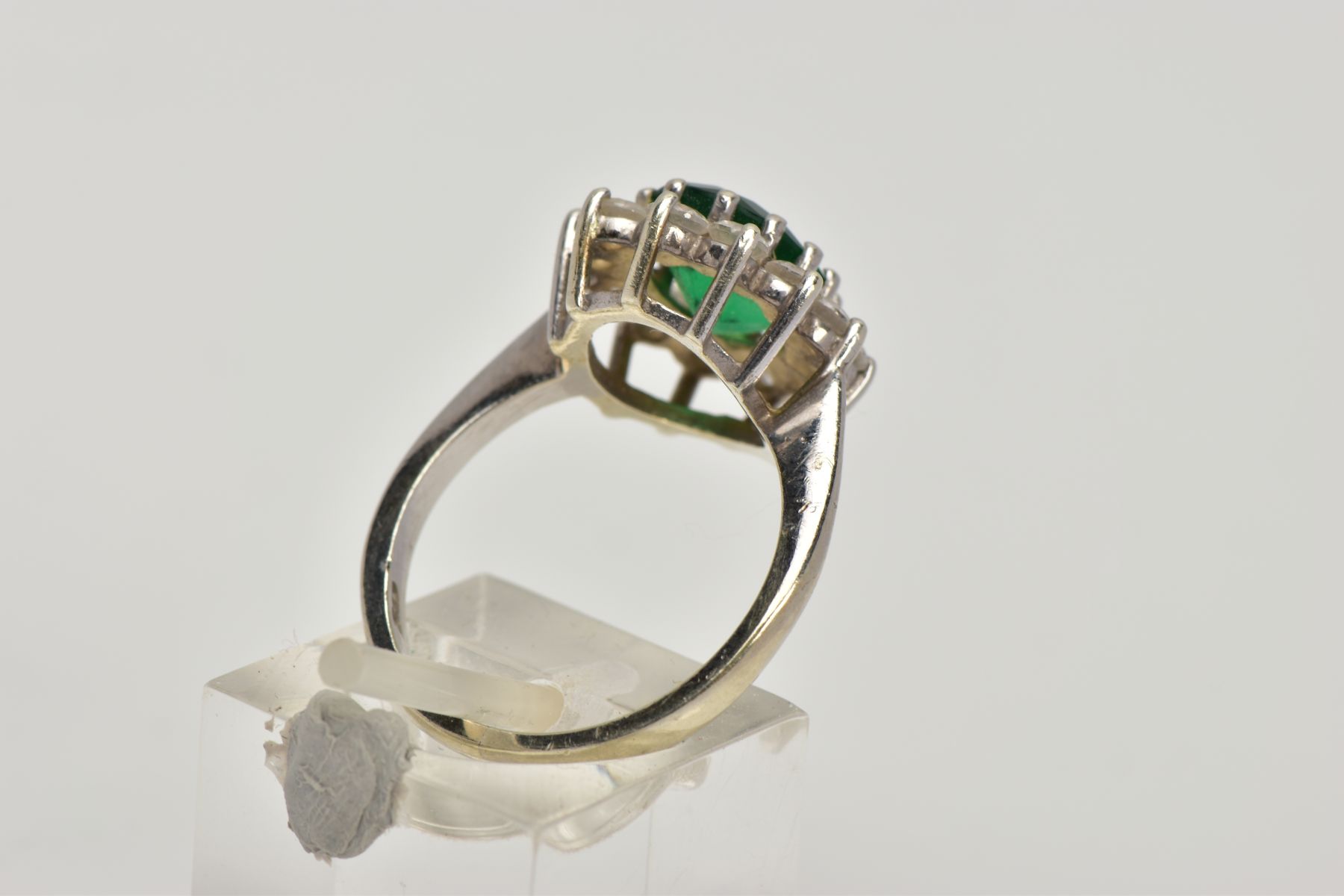 A 9CT WHITE GOLD CLUSTER RING, designed with a central green stone assessed as paste, within a - Image 3 of 5